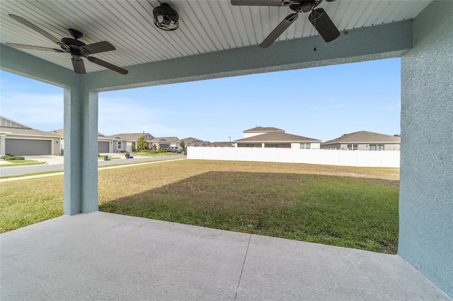 view of yard featuring ceiling fan