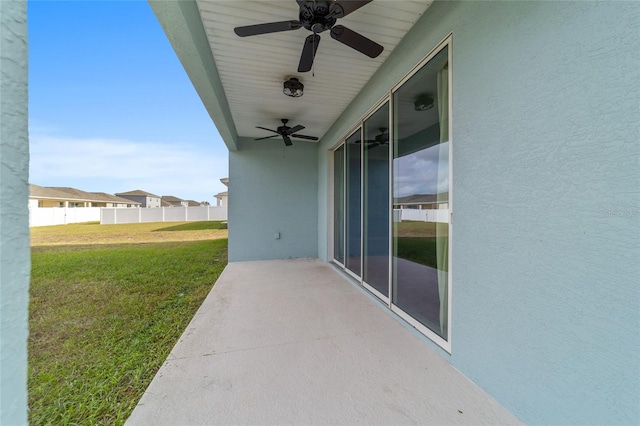 view of patio featuring ceiling fan