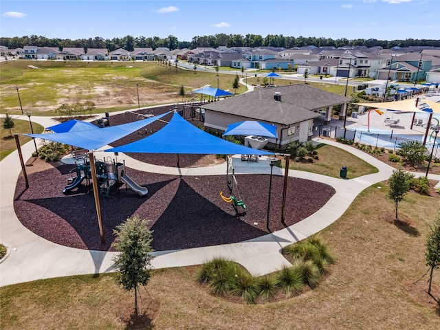 exterior space featuring a playground and a yard