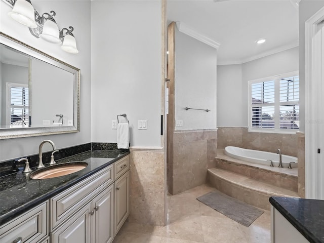 bathroom with a healthy amount of sunlight, tile walls, tiled bath, and ornamental molding