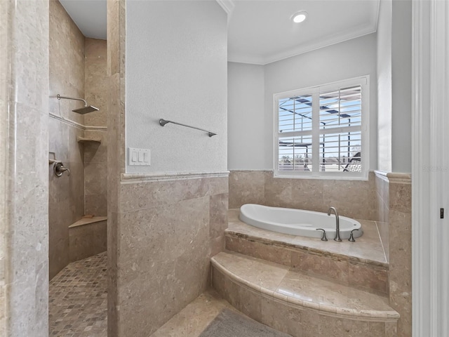 bathroom with shower with separate bathtub, ornamental molding, and tile walls