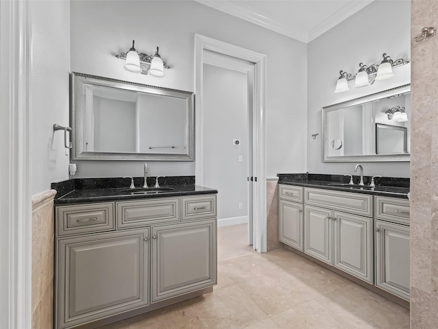 bathroom with vanity, crown molding, and tile patterned flooring