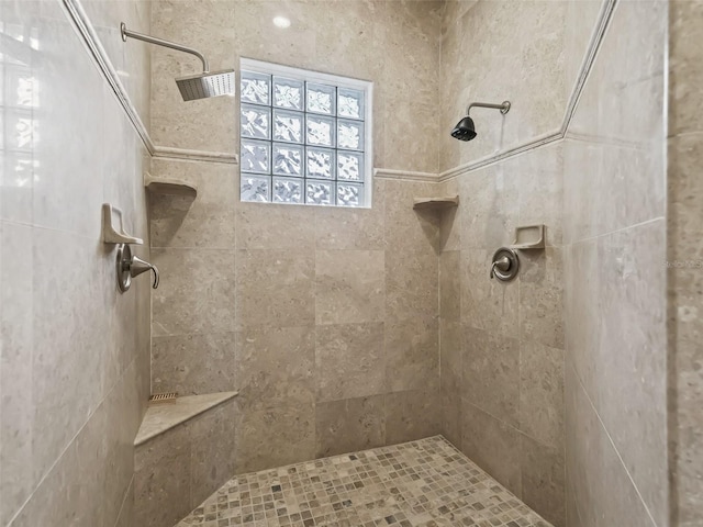 bathroom with tiled shower