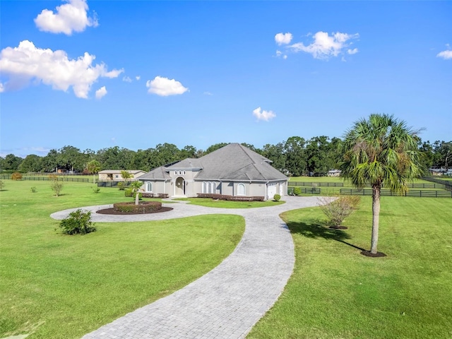 view of property's community featuring a lawn