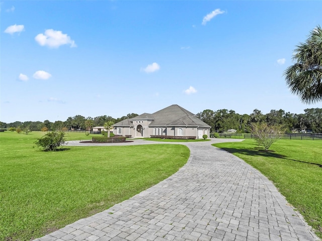 view of home's community featuring a lawn