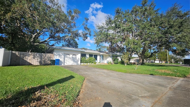 ranch-style house with a garage and a front yard