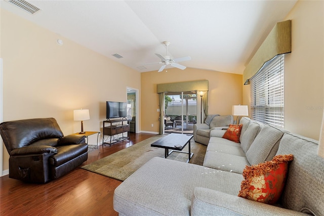 living room featuring ceiling fan, a healthy amount of sunlight, vaulted ceiling, and wood-type flooring