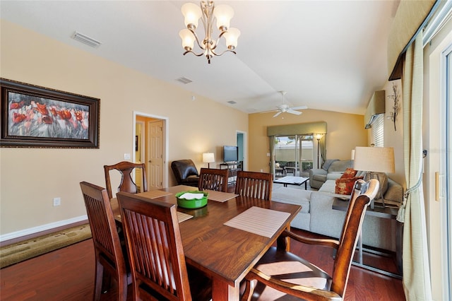 dining space featuring dark hardwood / wood-style floors, lofted ceiling, and ceiling fan with notable chandelier