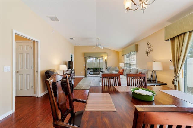 dining room with dark hardwood / wood-style flooring, ceiling fan, and lofted ceiling