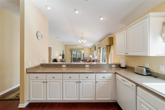 kitchen with white cabinets, vaulted ceiling, a chandelier, dishwasher, and dark hardwood / wood-style floors