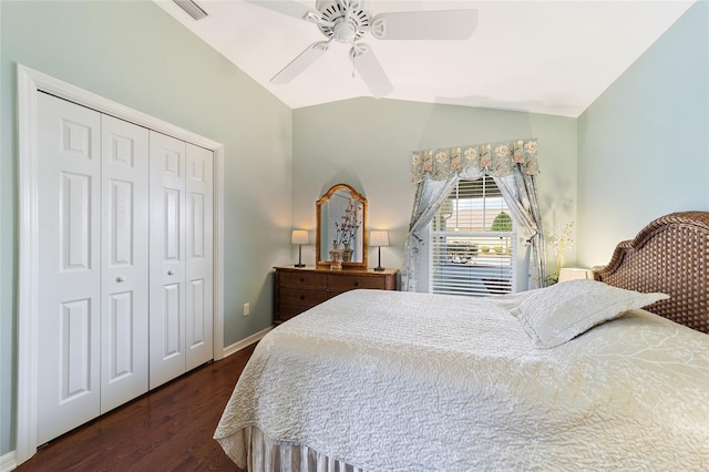 bedroom with ceiling fan, vaulted ceiling, dark wood-type flooring, and a closet