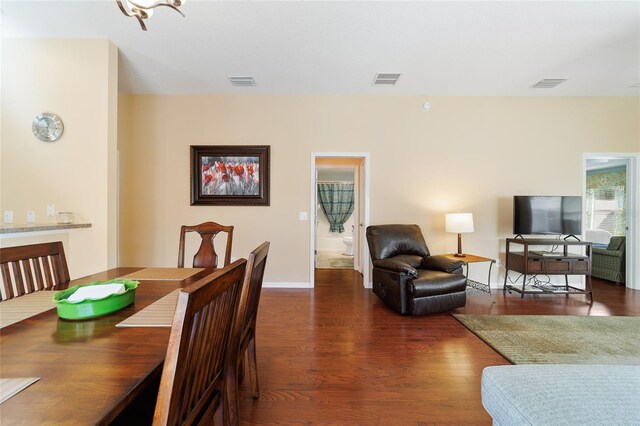 dining room with dark hardwood / wood-style flooring