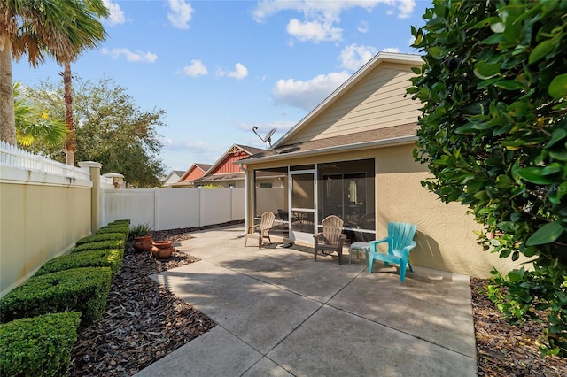 view of patio / terrace featuring a sunroom