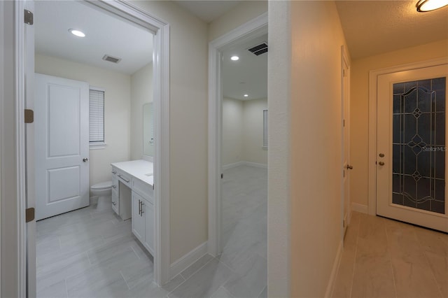 bathroom with toilet and vanity