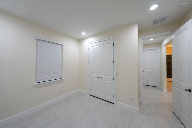 unfurnished bedroom with a closet