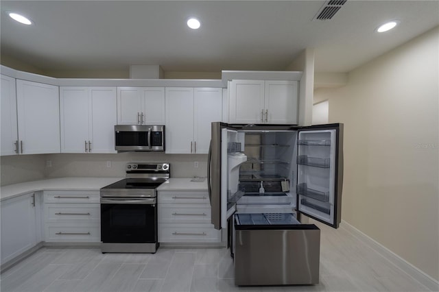 kitchen featuring white cabinets and stainless steel appliances