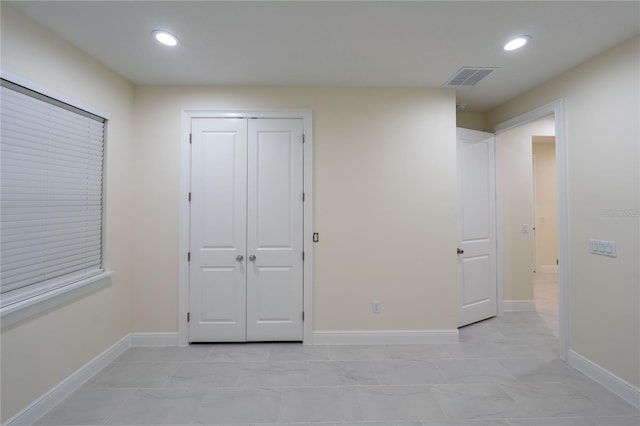 unfurnished bedroom with a closet