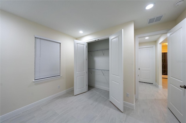 unfurnished bedroom with a closet