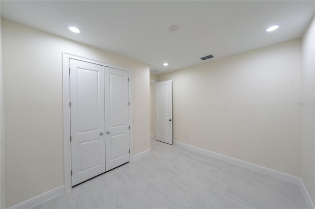 unfurnished bedroom featuring a closet