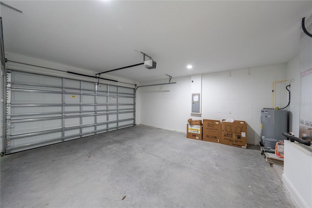 garage featuring electric panel, water heater, and a garage door opener