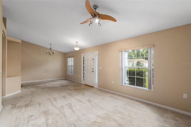 3107 NE 24th Pl, Ocala, FL 34470 - carpeted foyer entrance featuring plenty of natural light, a chandelier, baseboards, and vaulted ceiling