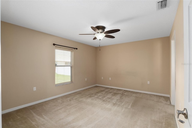 3107 NE 24th Pl, Ocala, FL 34470 - empty room featuring light carpet, ceiling fan, and baseboards