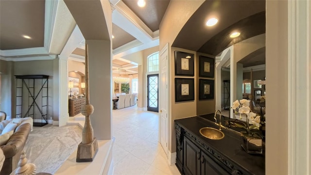 bathroom with tile patterned flooring, vanity, and ornamental molding