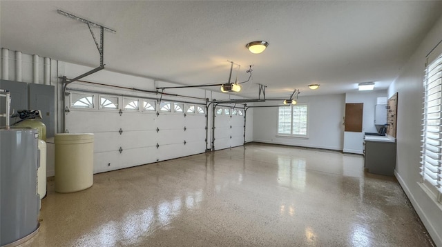 garage with a garage door opener and water heater