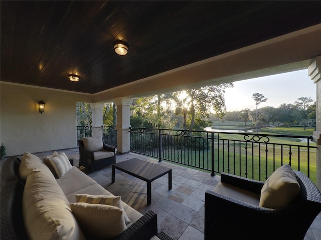 view of patio featuring an outdoor living space and a water view