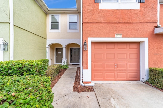 view of exterior entry featuring a garage