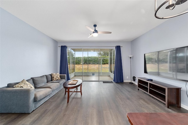 living room with ceiling fan and hardwood / wood-style flooring