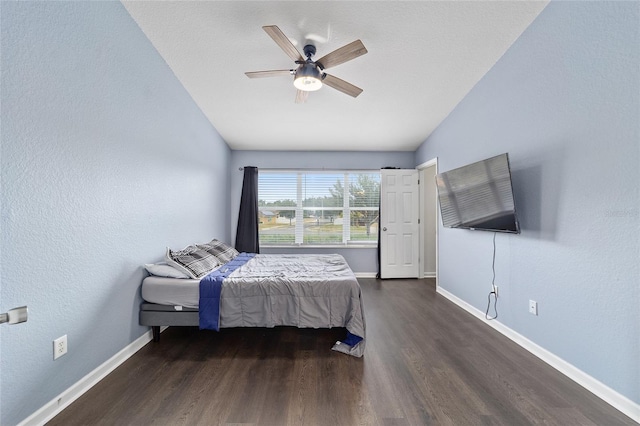 bedroom featuring vaulted ceiling, ceiling fan, and dark hardwood / wood-style floors