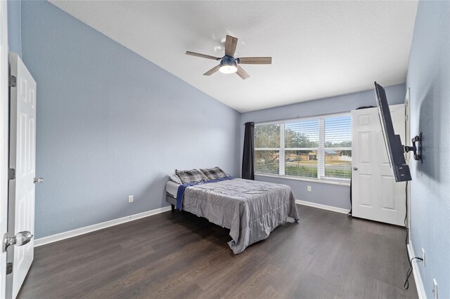 bedroom with vaulted ceiling, ceiling fan, dark hardwood / wood-style floors, and pool table