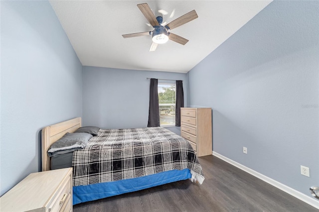 bedroom with ceiling fan and dark hardwood / wood-style floors