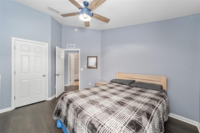 bedroom featuring dark hardwood / wood-style flooring and ceiling fan