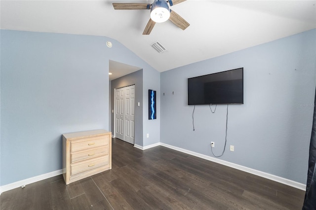 unfurnished living room with lofted ceiling, ceiling fan, and dark wood-type flooring