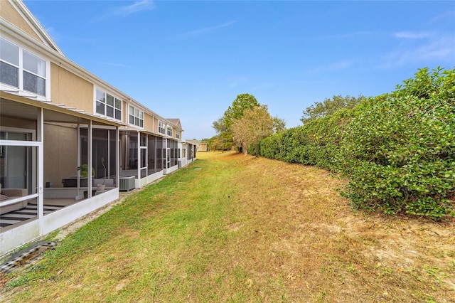 view of yard with central AC