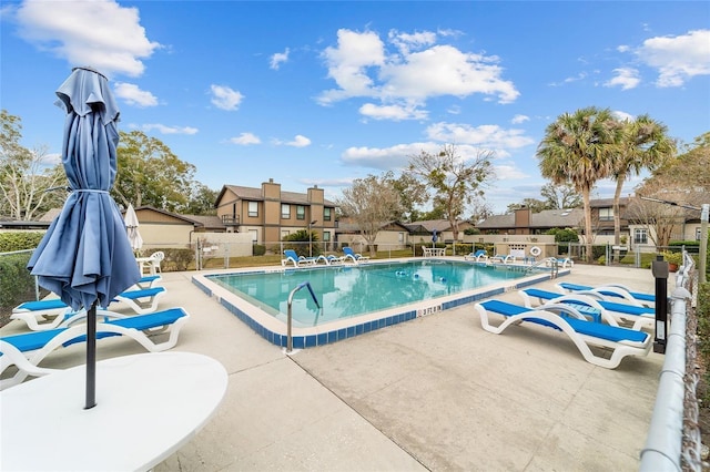 3824 NE 17th Street Cir, Ocala, FL 34470 - community pool featuring fence, a patio area, and a residential view