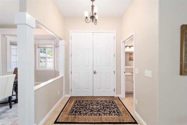 entrance foyer with an inviting chandelier and light tile patterned flooring