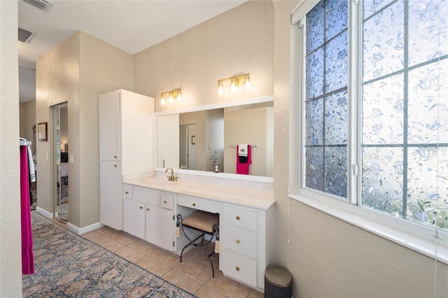 bathroom with tile patterned floors and vanity