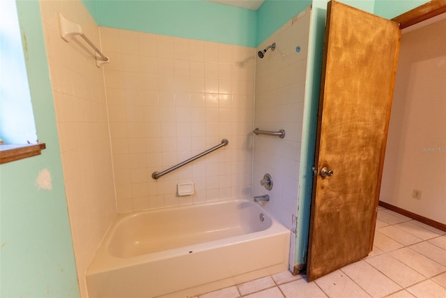 bathroom with tiled shower / bath combo and tile patterned floors