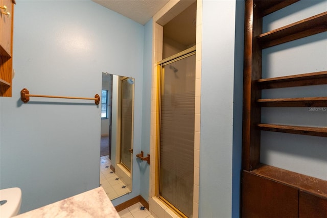 bathroom featuring tile patterned floors and walk in shower