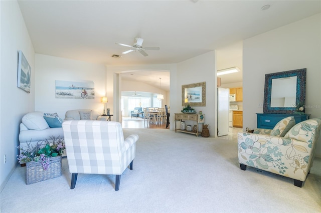 carpeted living room featuring ceiling fan