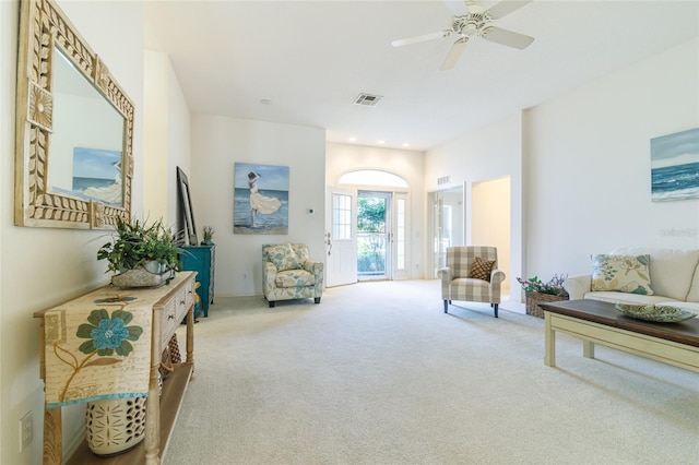 sitting room featuring carpet flooring and ceiling fan