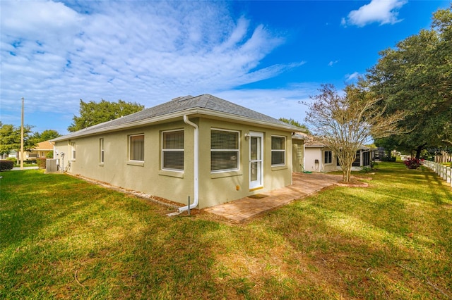 view of home's exterior featuring a yard and cooling unit