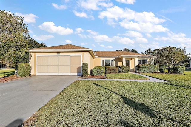 view of front of property with a front yard and a garage