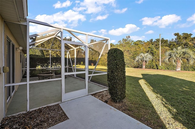 view of yard featuring glass enclosure