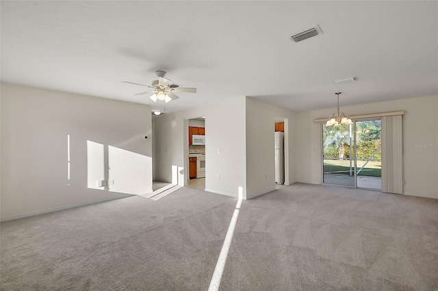 unfurnished room featuring light colored carpet and ceiling fan with notable chandelier