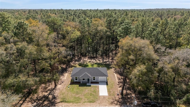 drone / aerial view with a view of trees