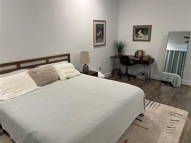 bedroom featuring dark wood-type flooring